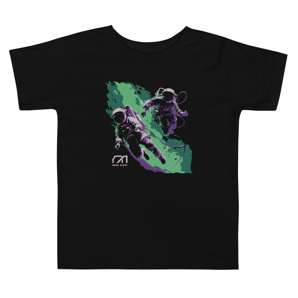 Nerd Alert's Spacemen toddler T-shirt design with two astronauts floating in front of a green and purple galaxy and the Nerd Alert logo.